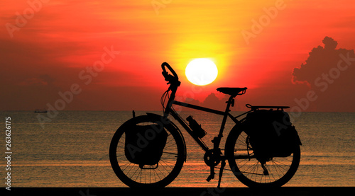 silhouette vintage bike on sunrise