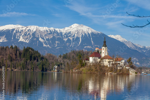 Lake Bled against snowy mountain peaks in early spring. Slovenia, Europe © vvvita