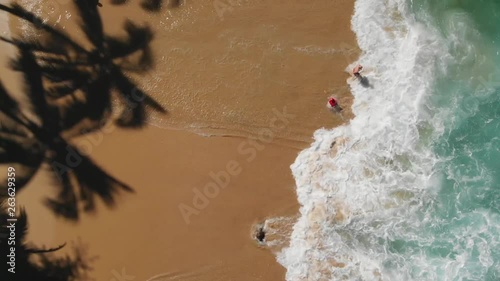 Waves hitting rocks and paradise beach in Mexico photo