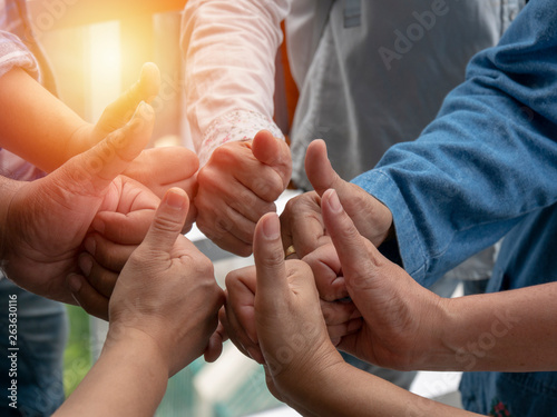 people join their hands together. Stack people's hands. Unity and teamwork, connection  concepts. closeup view. photo