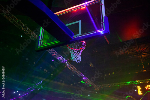 basketball hoop and sports arena in laser lights