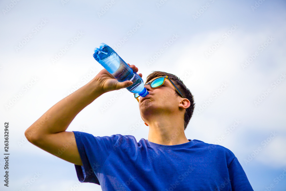 Fotografie Young Man drink a Water