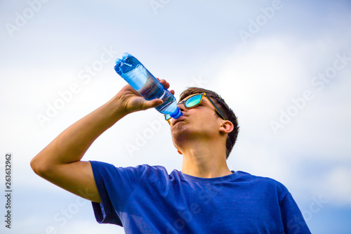 Young Man drink a Water