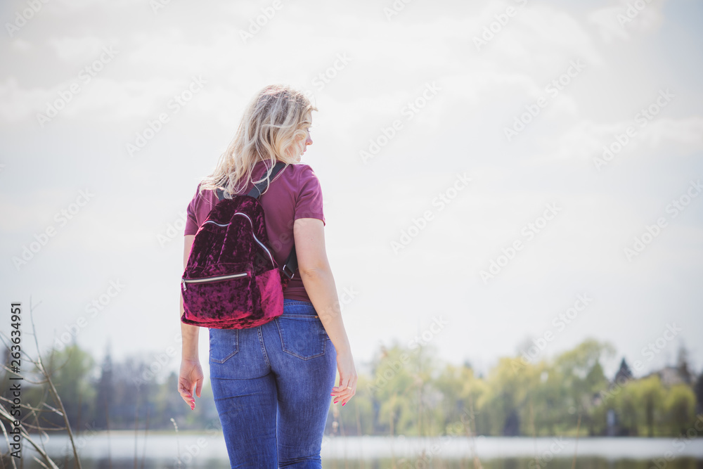 Travel concept, American or European appearance woman walks and enjoying life. Plus size model, stylishly dressed casual style. Natural beauty 