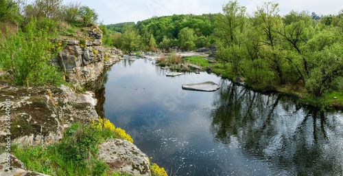 Panoramic view of the river section with rocky shore