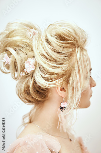 Bride with beautiful hair styling in studio on white background. Wedding Mood and Trend Hairstyles.