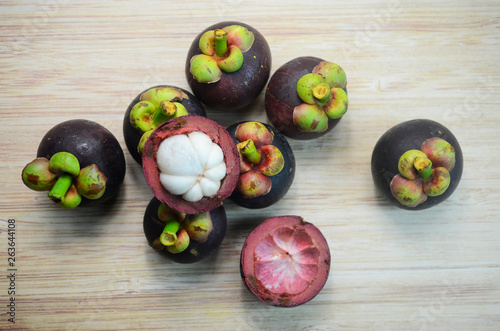 Mangosteen fruits on wooden background