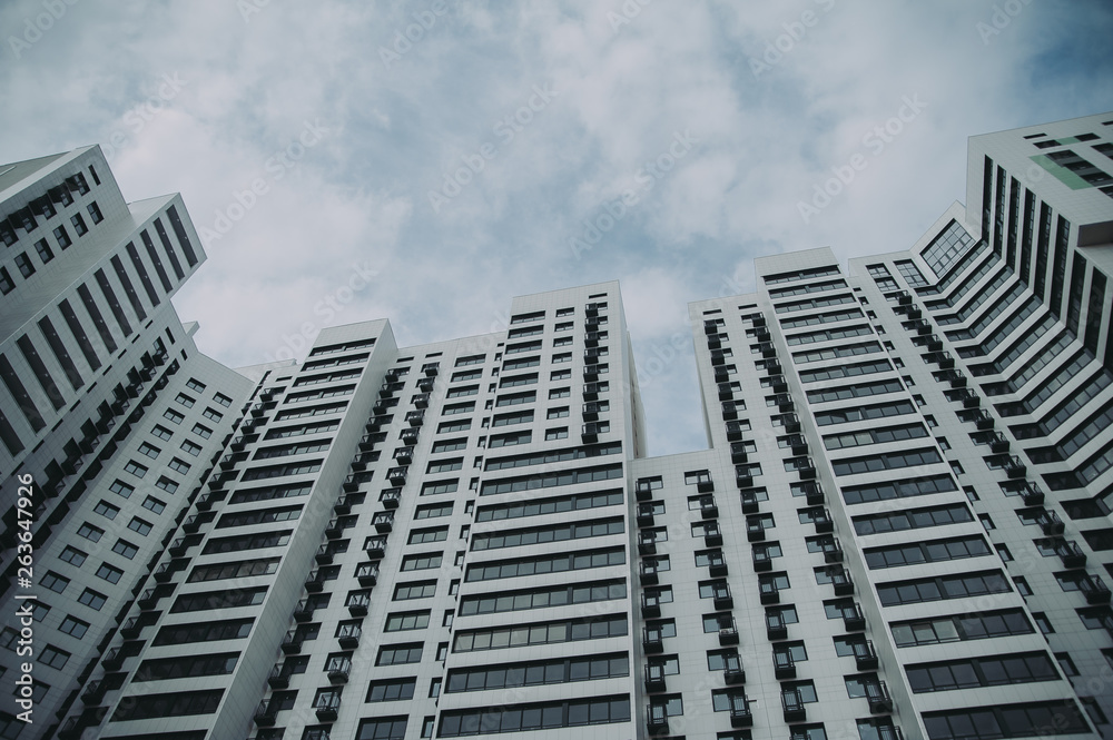 Fototapeta premium high multistory building against the blue sky