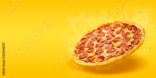 Creative layout of hot delicious pizza with smoke in flying on summer orange background. Pizza pepperoni design mockup flyer or poster for promotions and discounts with copy space. Fast Food concept