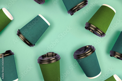 A lot of multicolored cups. Place for text.