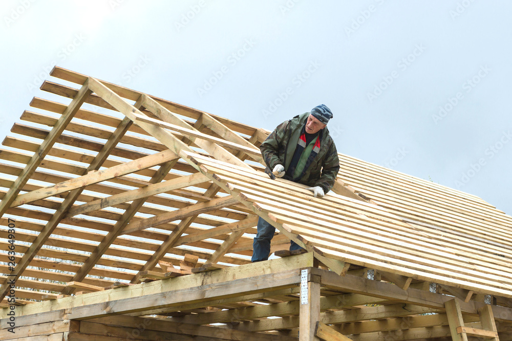 Construction of a wooden house in a rural area