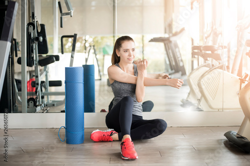 Pretty young sporty woman is warm up in gym, Healthy lifestyle