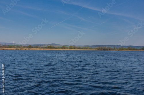 Ersten Sonnenstrahlen einfangen am Breitungen See im wunderschönen Werratal photo