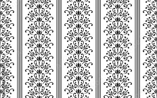 Wallpaper in the style of Baroque. Seamless vector background. White and black floral ornament. Graphic pattern for fabric, wallpaper, packaging. Ornate Damask flower ornament