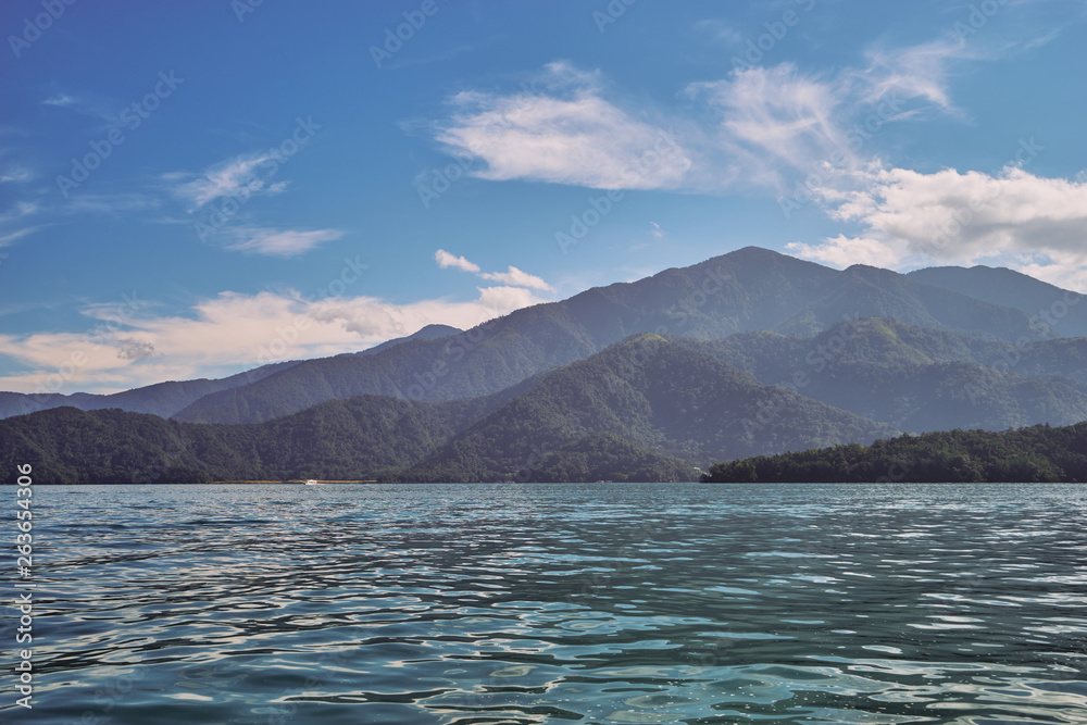 Beautiful nature scenics of Sun Moon Lake with the surrounding mountains are the highlight at this sprawling lake at Yuchi, Nantou in Taiwan.