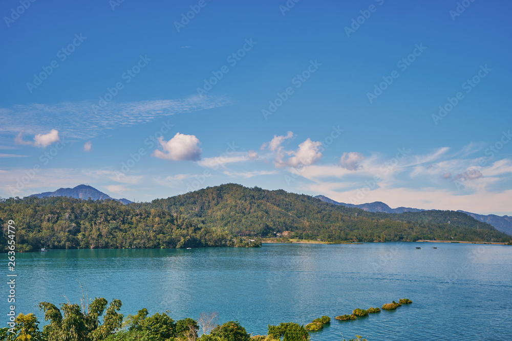 Beautiful nature scenics of Sun Moon Lake with the surrounding mountains are the highlight at this sprawling lake at Yuchi, Nantou in Taiwan.