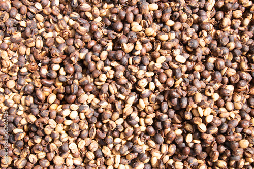 Coffee beans background.Brown roasted coffee beans pattern in coffee shop prepared for making cappuccino or latte hot drink.