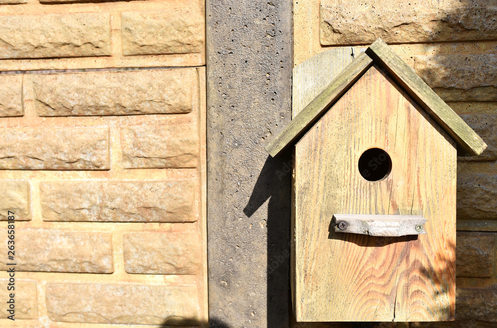 Closeup of a weathered birdhouse.