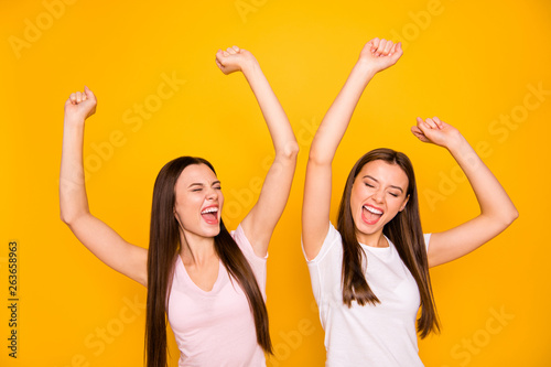 Portrait of positive attractive beautiful people ladies have trip luck lucky achieve goals isolated close eyes scream shout yeah raise fists hands wear pastel clothes bright background 