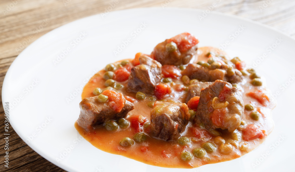 beef stew with tomato, onion, and peas beef stew with tomato, onion, and peas