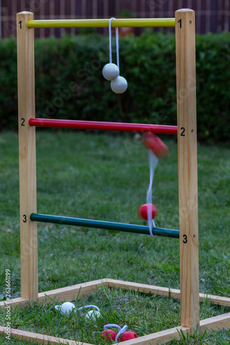 Game of ladder golf set up outdoors in a garden