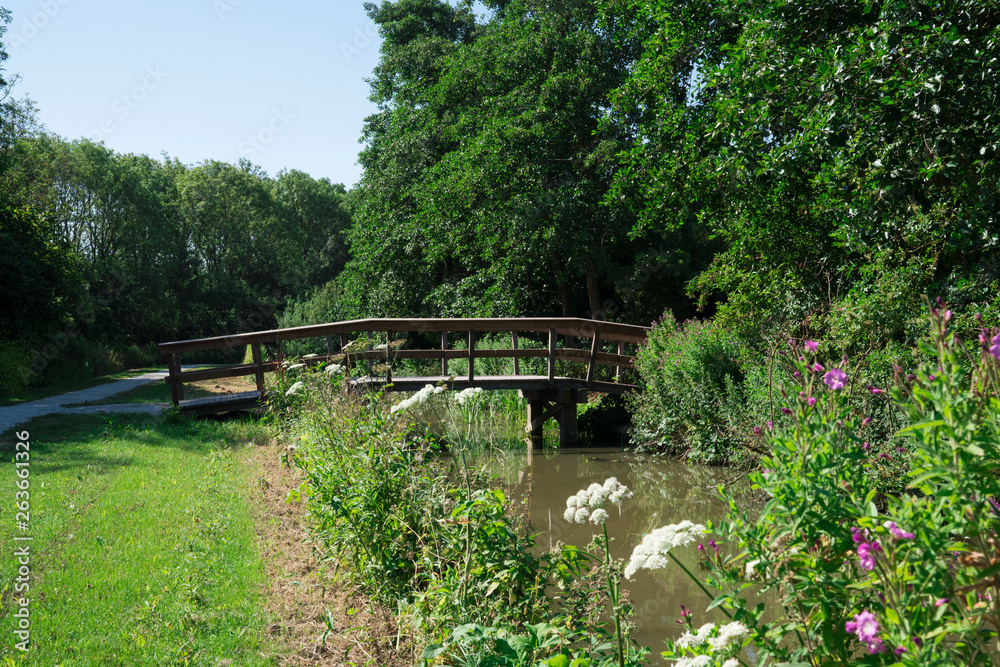 bridge across water in recreation park De Hulk, Hoorn, The Netherlands
