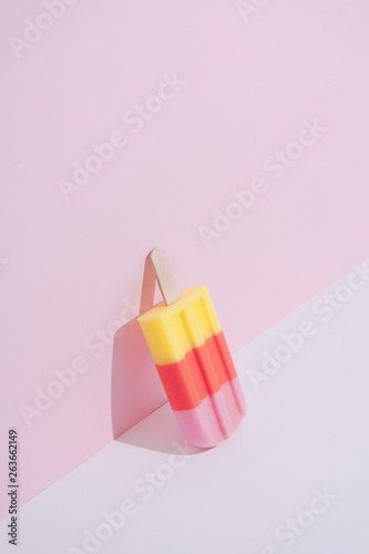 Fotografia, Obraz Colorful Ice cream popsicle on pastel pink background