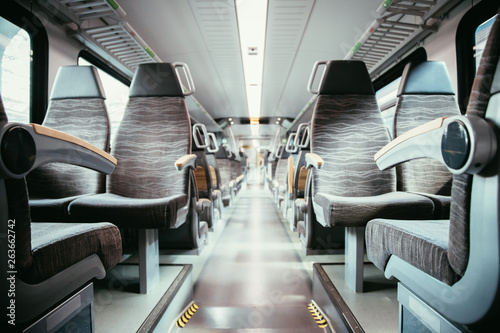 Interior of a public transport train, empty seats