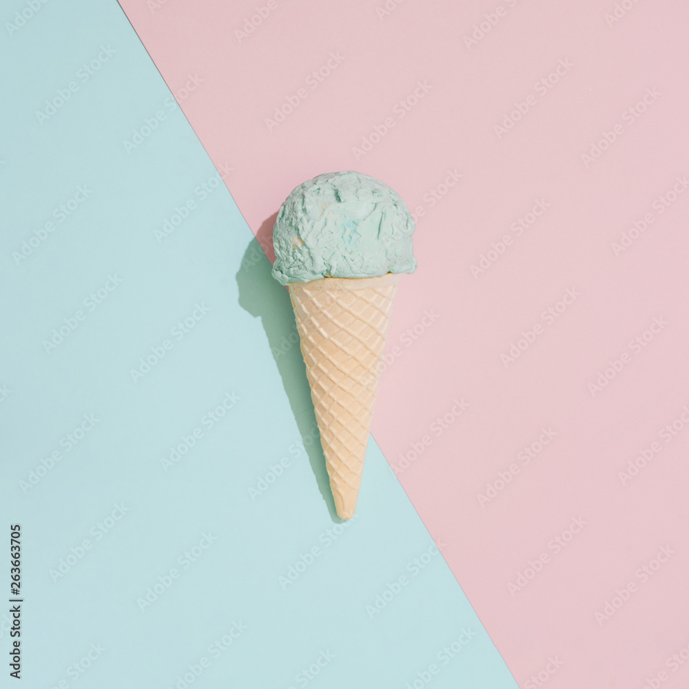 Ice cream on pastel pink and blue background. Minimal summer food
