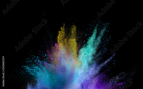 Explosion of colored powder on black background