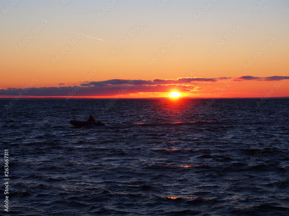 Sunset on the water. Beautiful water is illuminated by sunlight. Details and close-up.