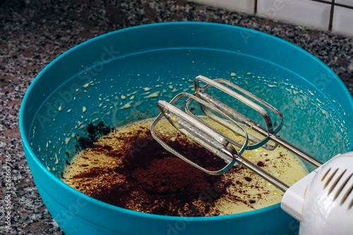 Preparing brownie cake at home with mixer whisk and oven processes