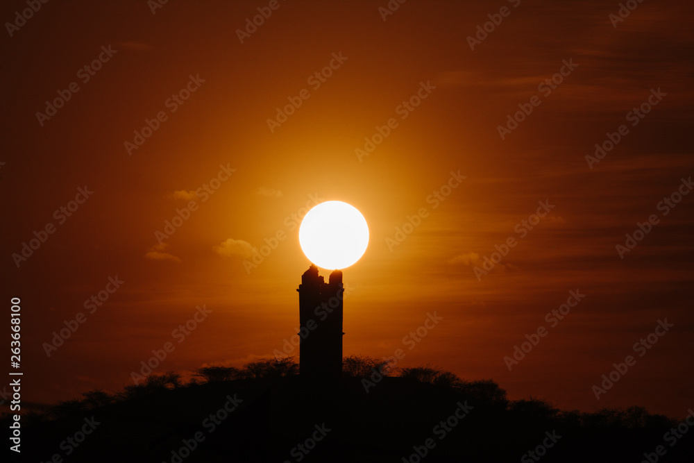 silhouette of a tower at sunset