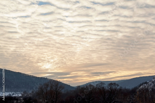 Beautiful after the sky over the mountains and the forest.