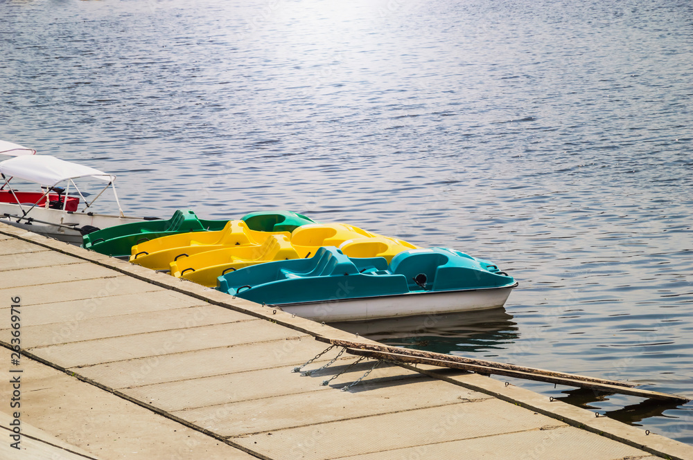 Fototapeta premium colorful catamarans on the pier
