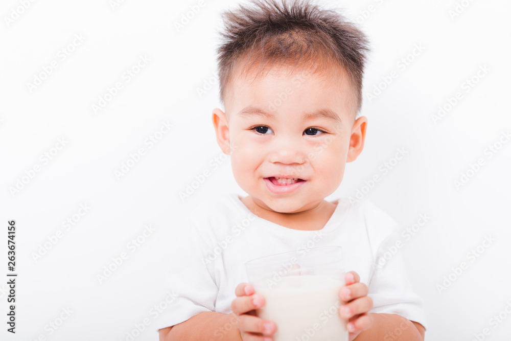 Asian portrait child boys 1 year 6 months drinking milk on glass Asian portrait child boys 1 year 6 months drinking milk on glass