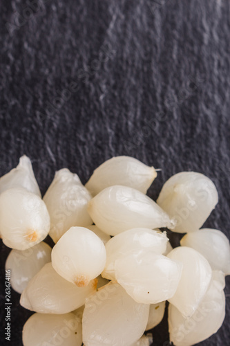 pickled vegetables on a dark stone background