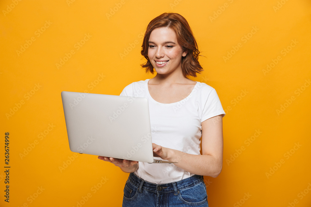 Portrait of a happy lovely girl standing isolated
