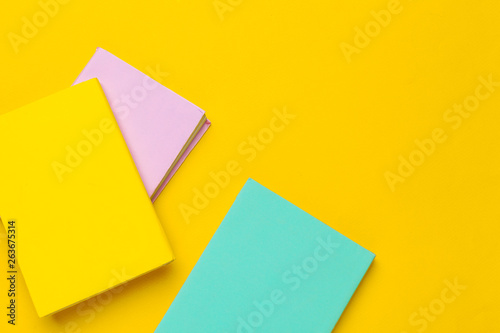 Books on a yellow background