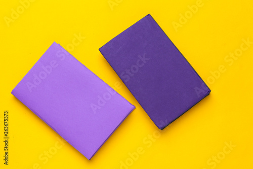 Books on a yellow background