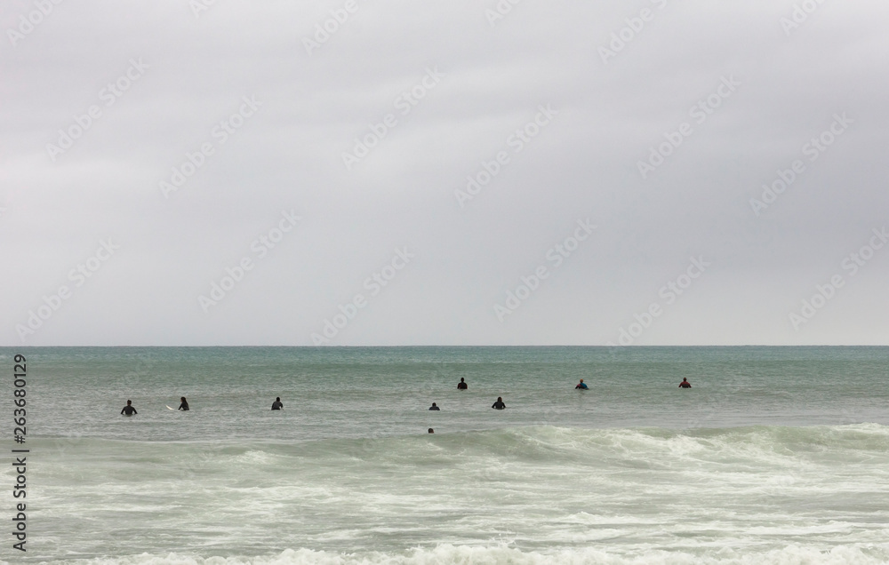 surfers waiting the wave