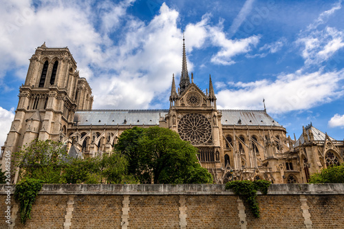 Famous Notre-Dame de Paris cathedral under beautiful sky.