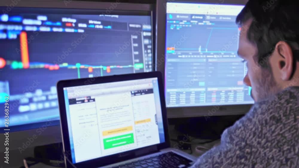 Man looks at cryptocurrency market trend Man looks at cryptocurrency market trend