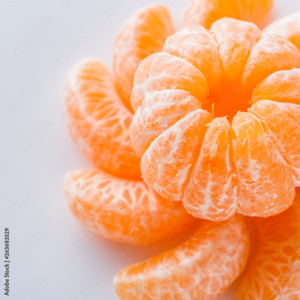 juicy mandarin on a white acrylic background juicy mandarin on a white acrylic background