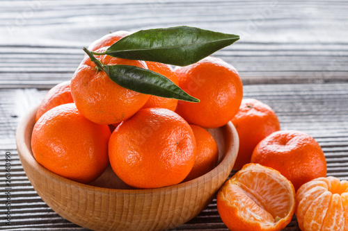 juicy mandarin on a gray wooden rustic background