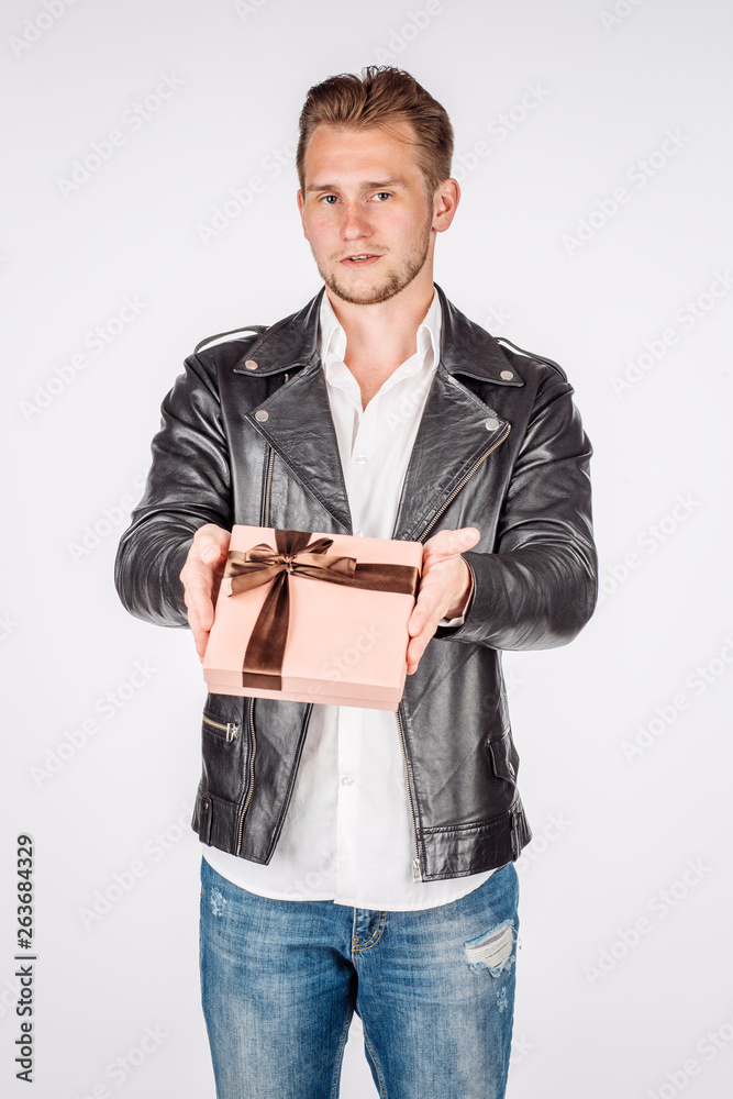 portrait of young man in black eather jacket isolated on a white background. Emotion and people concept. portrait of young man in black eather jacket isolated on a white background. Emotion and people concept.