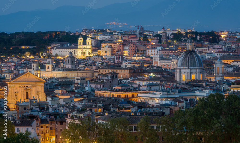 Evening panorama with Trinità dei Monti from the Gianicolo Terrace in Rome, Italy.
