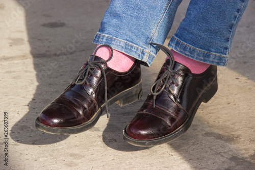 Patent leather shoes with stylish pink socks.