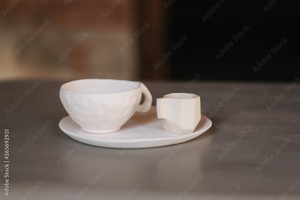 Fototapeta premium Ceramic cup for tea coffee and plate on the table
