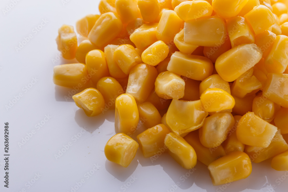 Canned corn on a white acrylic background Canned corn on a white acrylic background